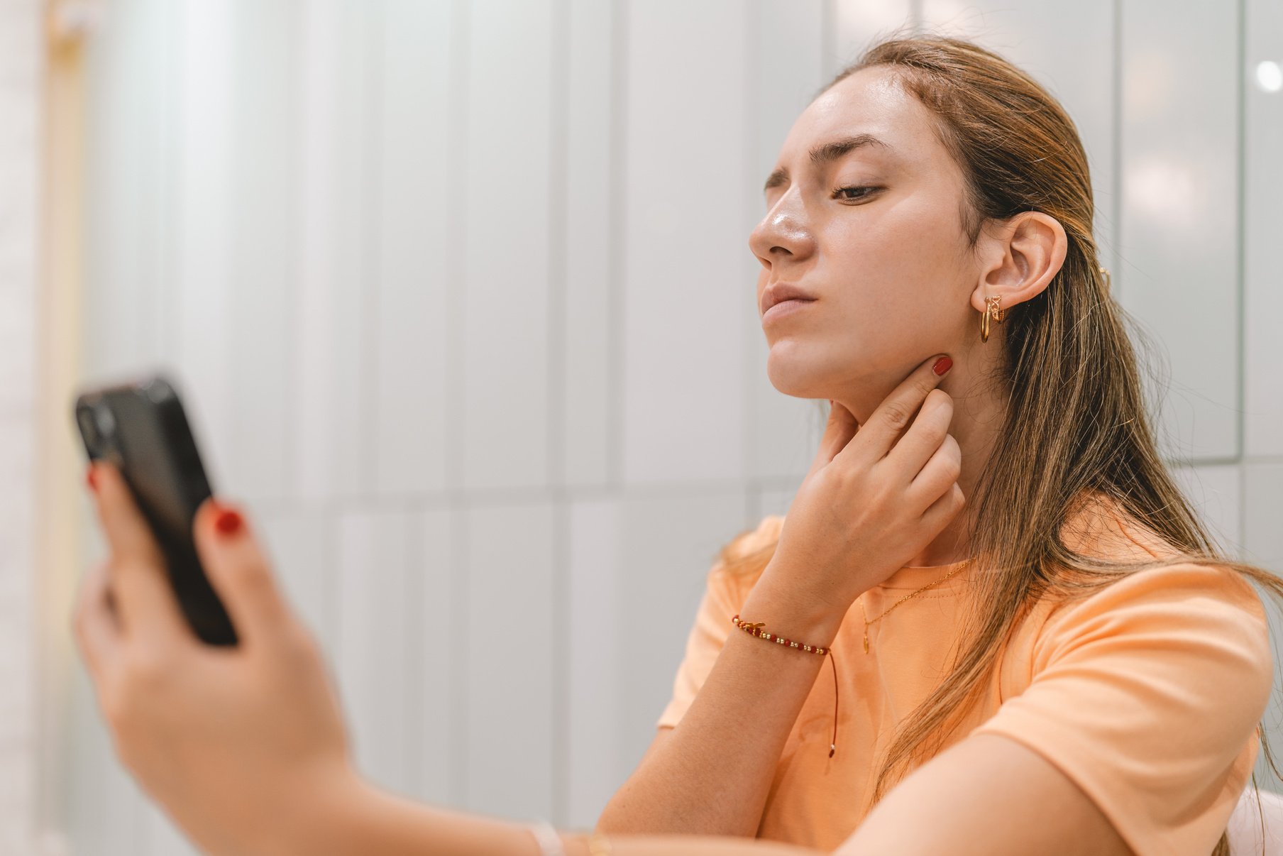 Young woman dissatisfied with her double chin